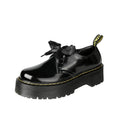 Women's black and white thick-soled leather shoes with lace-up closure and decorative straps