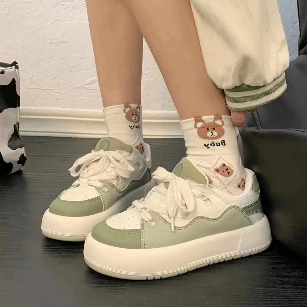 Green women's casual shoes with PU mesh upper, flat heel, and round toe design