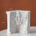 Glazed ceramic book stand in a modern design, showing one of four colour options.