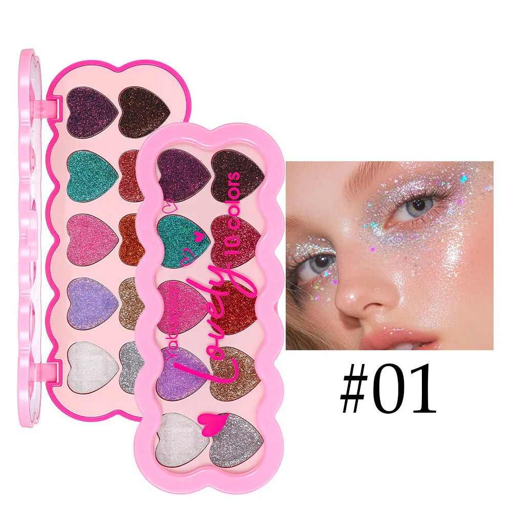 Pearlescent heart-shaped ten-colour sequin eyeshadow palette open, showing pink, blue, black, and coral shades.