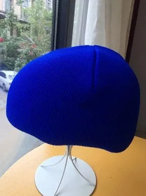 A size L decorative cover for a ski helmet, shown in one of fifteen available colour options.