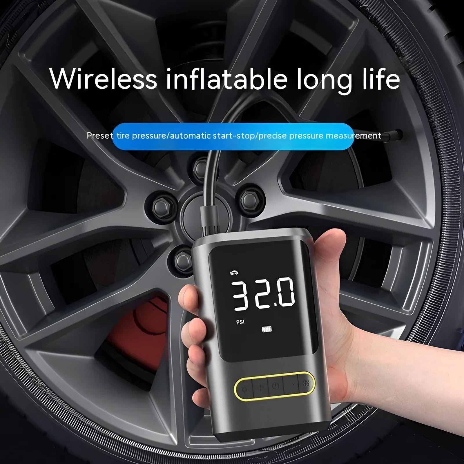 Black handheld digital wireless air pump with LED display and connected air hose on a grey background.