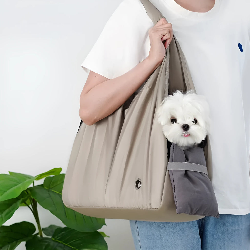 Apricot coloured cloth pet handbag measuring 41cm by 16cm by 28cm