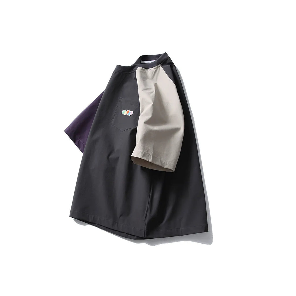 Dark grey men's loose fit t-shirt with contrasting colour panels on the raglan sleeves.