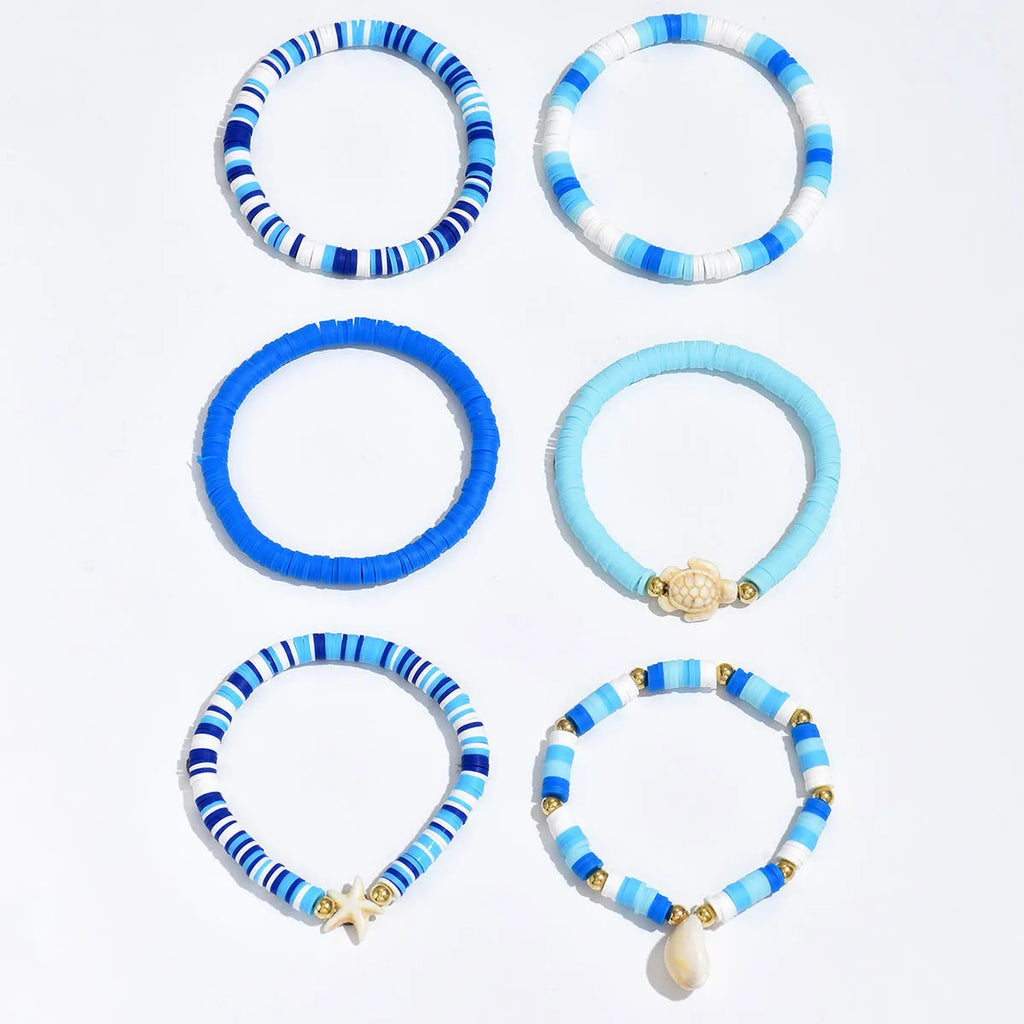 Bohemian blue polymer clay handmade shell bracelet suit with six geometric bracelets on display