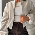 Women's off-shoulder short coat with lantern sleeves in polyester fabric, brown colour