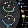 A set of two natural stone beaded bracelets showing zodiac symbol charms on a dark background.