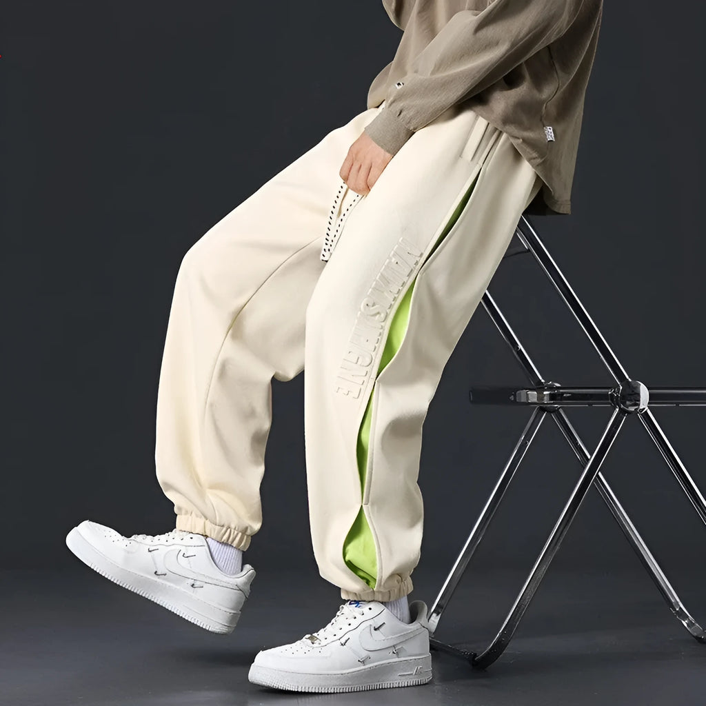 Men's loose fit trousers with stitching printing detail and banded ankle cuffs in micro elastic cotton fabric