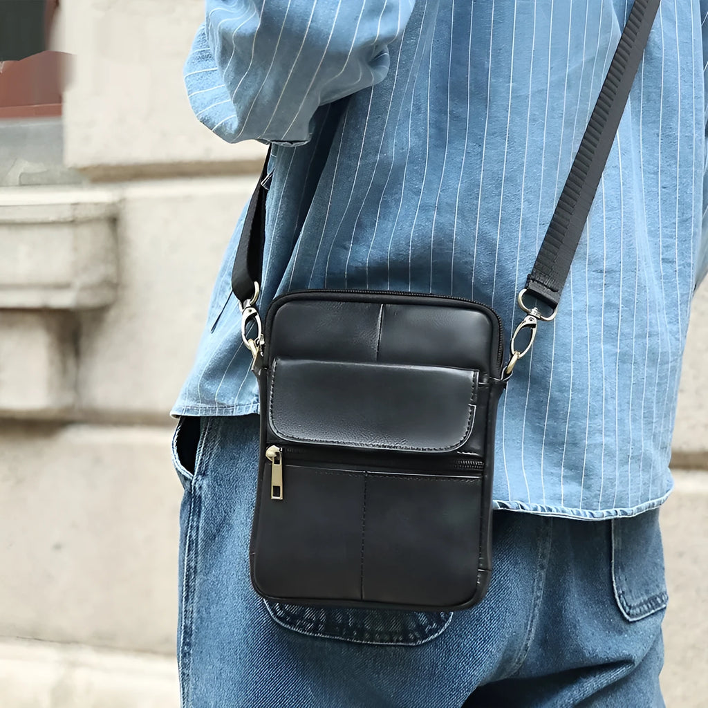 Men's brown genuine leather crossbody shoulder bag showing sewing line detailing