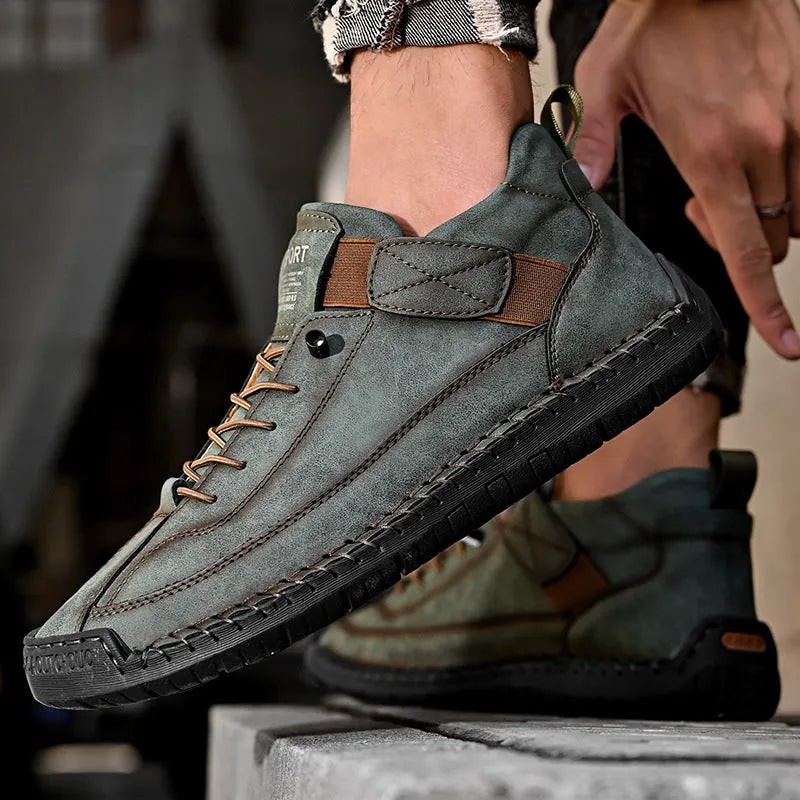Men's mid-top Martin boot in khaki colour with tooling stitching on the rubber sole.