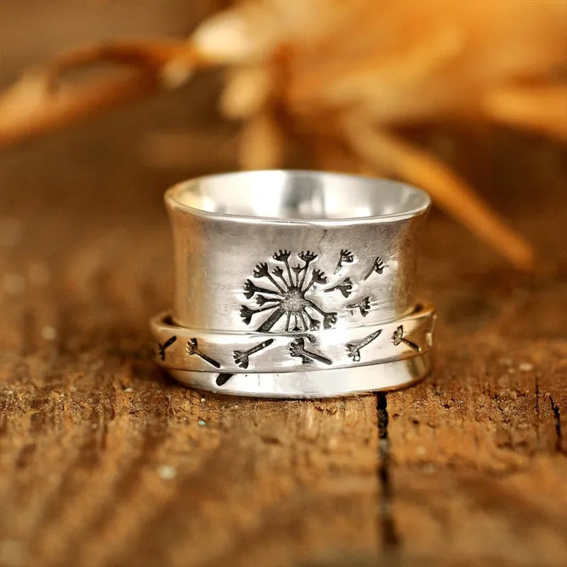 Silver rotatable flower ring with adjustable floral decoration on alloy band