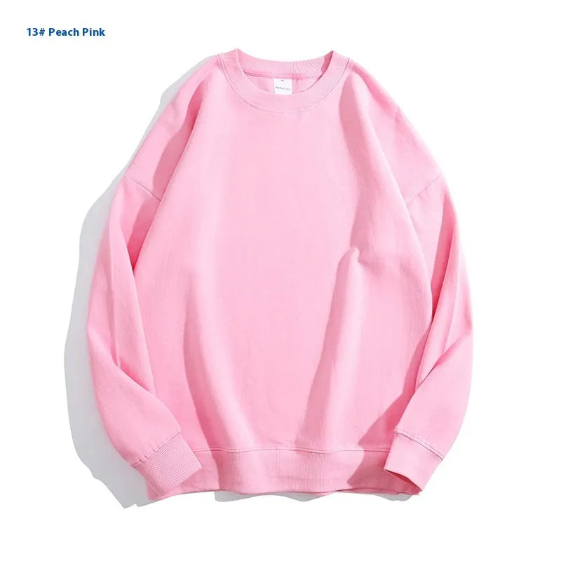 Women's loose fit cotton off shoulder sweater in a solid colour on a hanger.