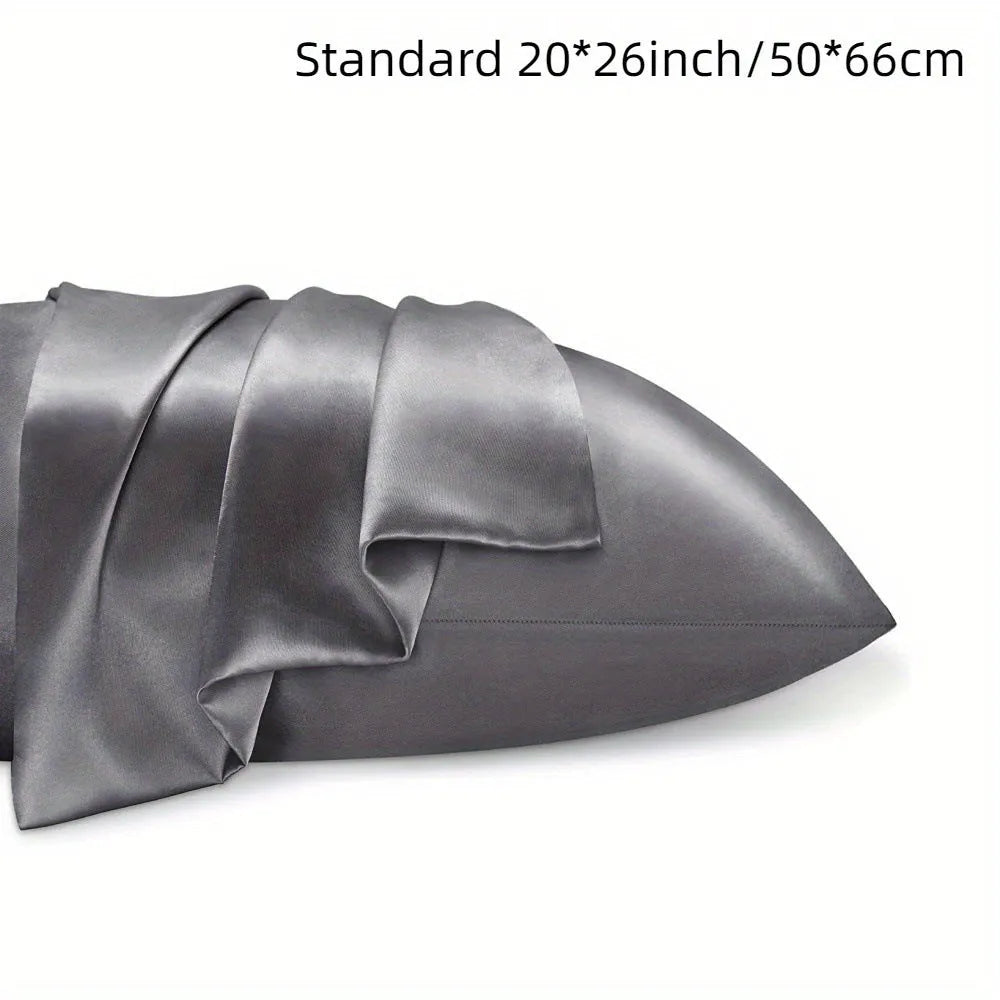 Pair of solid colour satin cloth pillowcases in polyester fibre available in twelve colours and four sizes