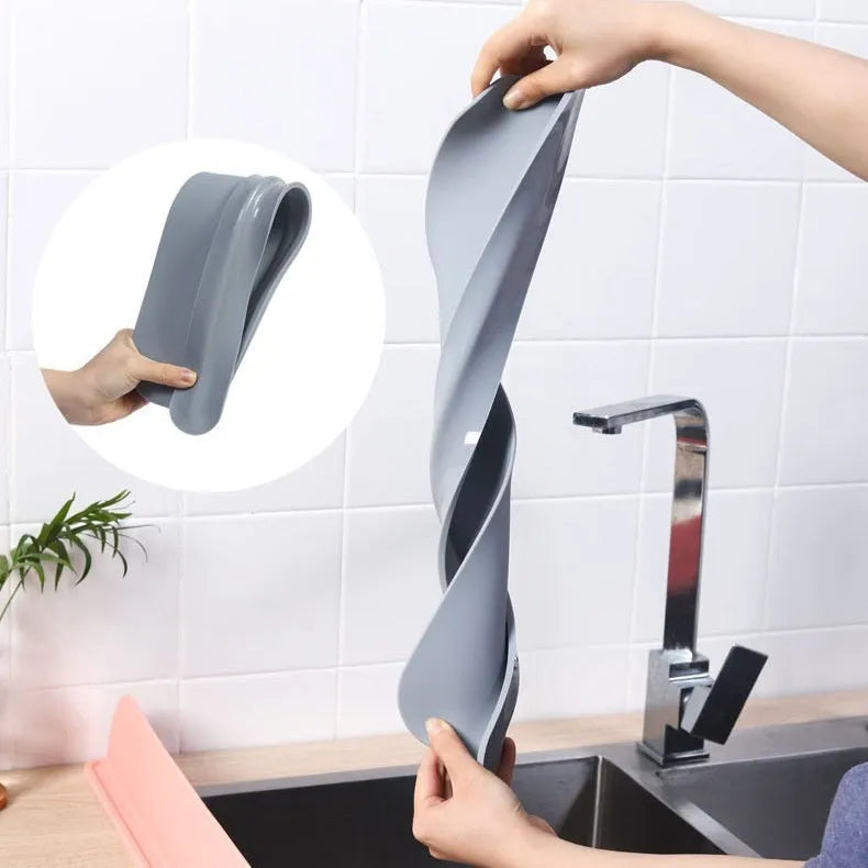 Grey silicone kitchen sink water blocking plate showing dimensions 52x5x85mm