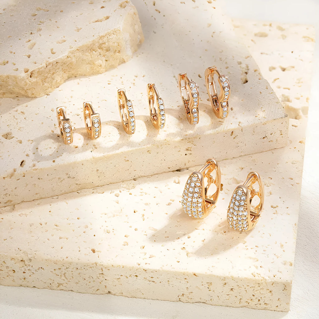 Gold plated heart-shaped zircon ear clip earrings with gang drill elements on copper base