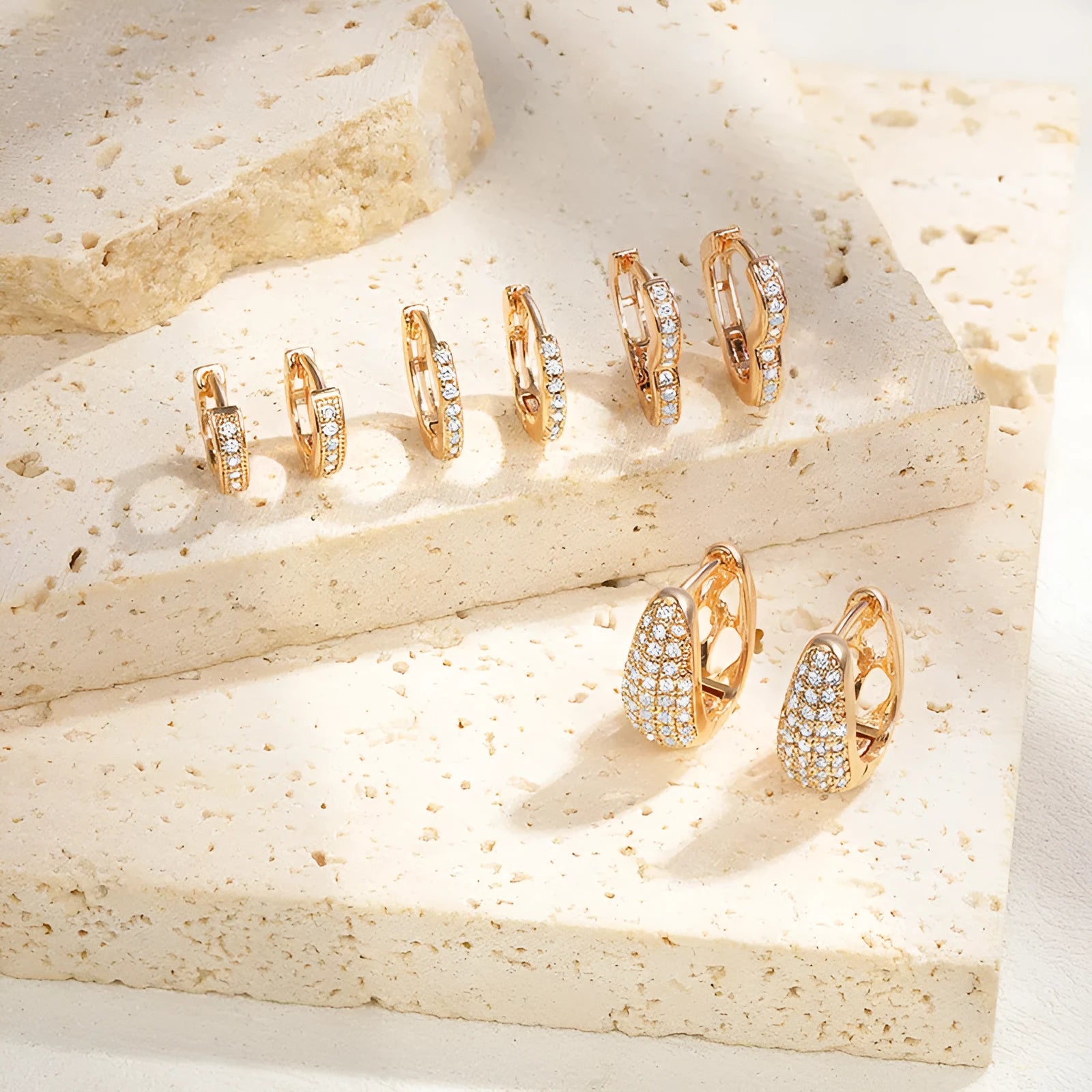 Gold plated heart-shaped zircon ear clip earrings with gang drill elements on copper base