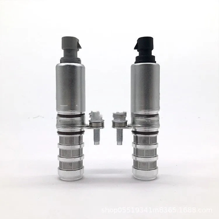 Pair of metal VVT oil control solenoid valves for Buick and Chevrolet car engines.