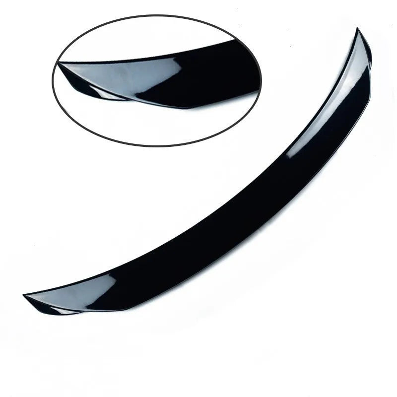 Mazda 3 Axela Exela rear diffuser spoiler tail trim in bright black installed on car bumper.