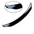 Mazda 3 Axela Exela rear diffuser spoiler tail trim in bright black installed on car bumper.