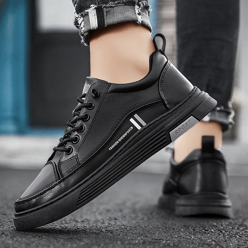 Men's low-top skate shoes in black with elastic band fastening and round toe.