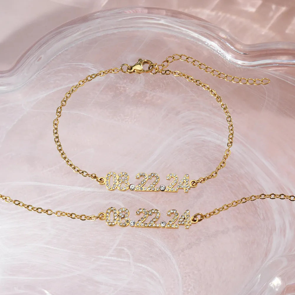 Stainless steel digital bracelet with diamond studded numbers, matching necklace option