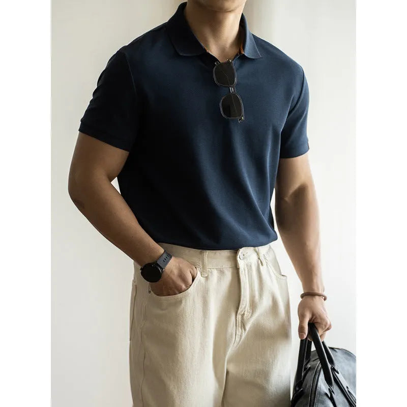 Blue cotton polyester blend short-sleeved polo shirt on a hanger, showing regular fit and casual style.
