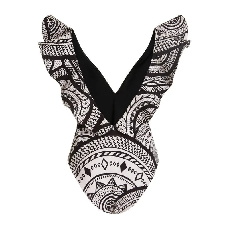 Women's vintage print one-piece swimsuit with deep V-neck and ruffles, shown with matching wrap skirt.