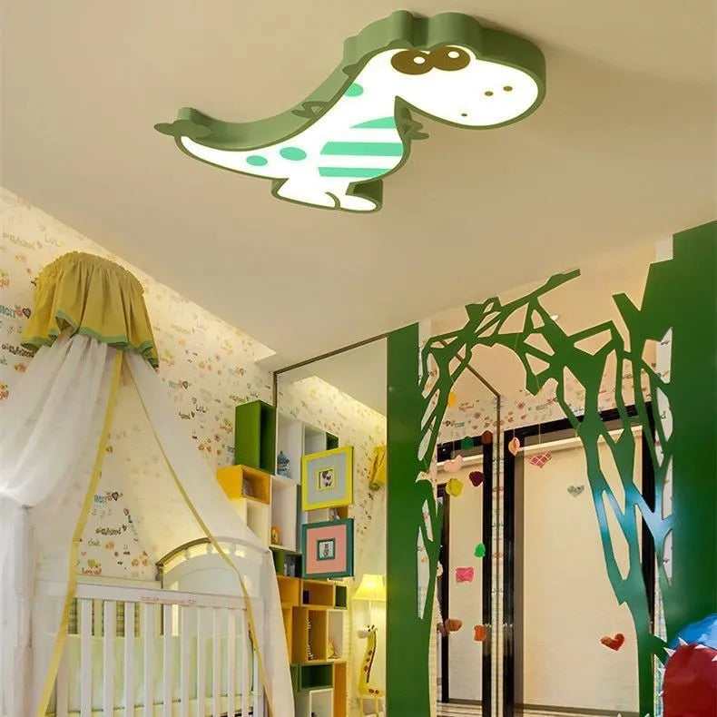 Green cartoon dinosaur ceiling light with dimmer switch on a white ceiling.