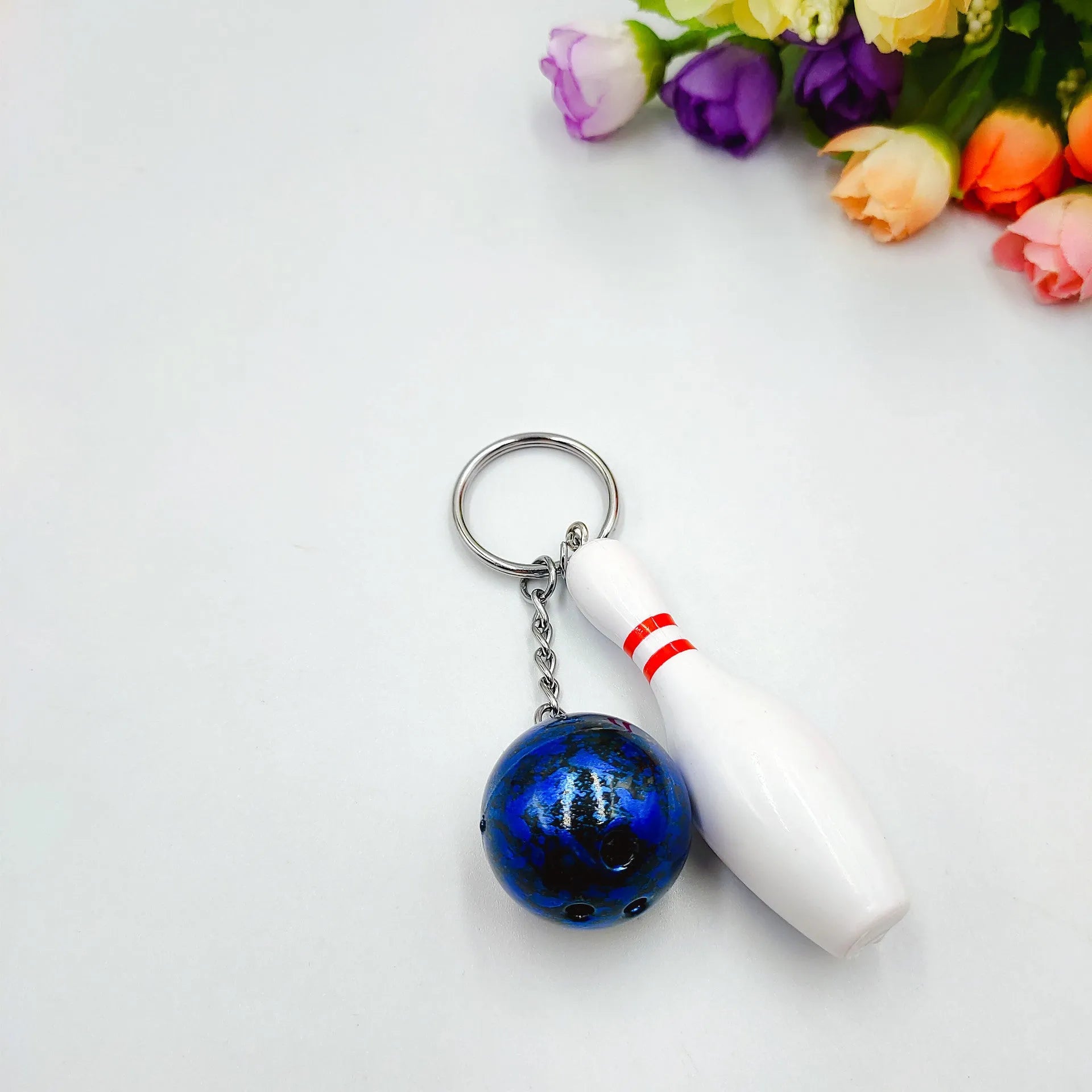 Mini simulation sports bowling keychain pendant in PVC metal on a key ring.