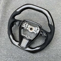 Eighth generation Toyota Camry carbon fiber steering wheel with colour style option shown on workbench