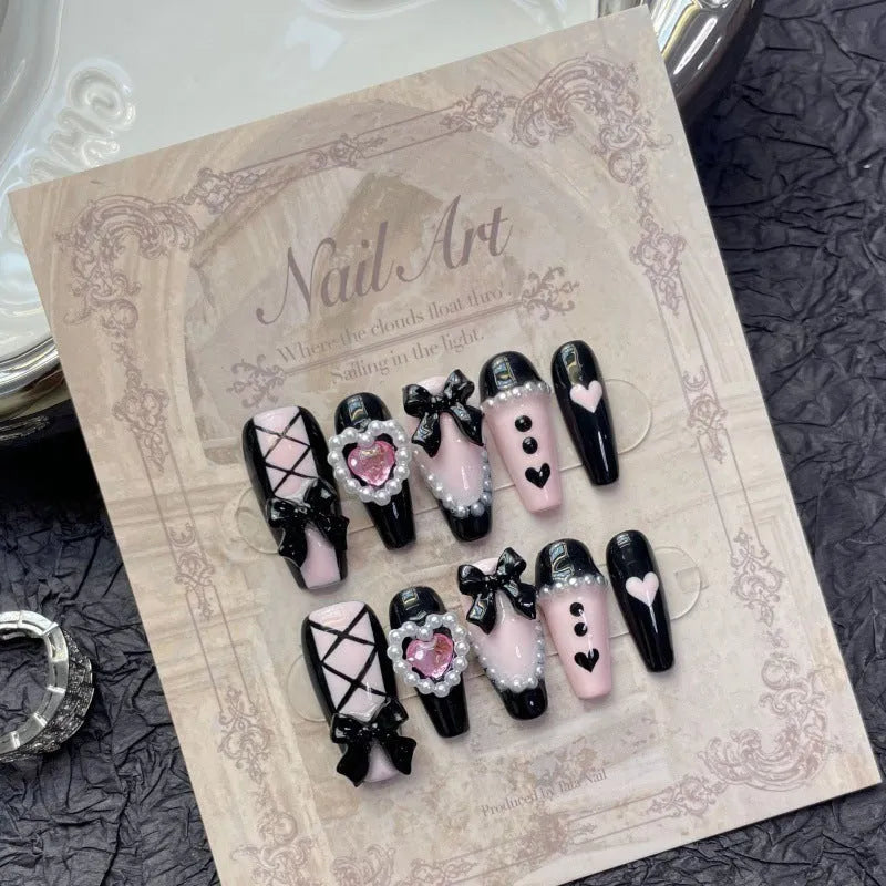 Black peach heart hand-painted false nails with cat's eye effect in four size options