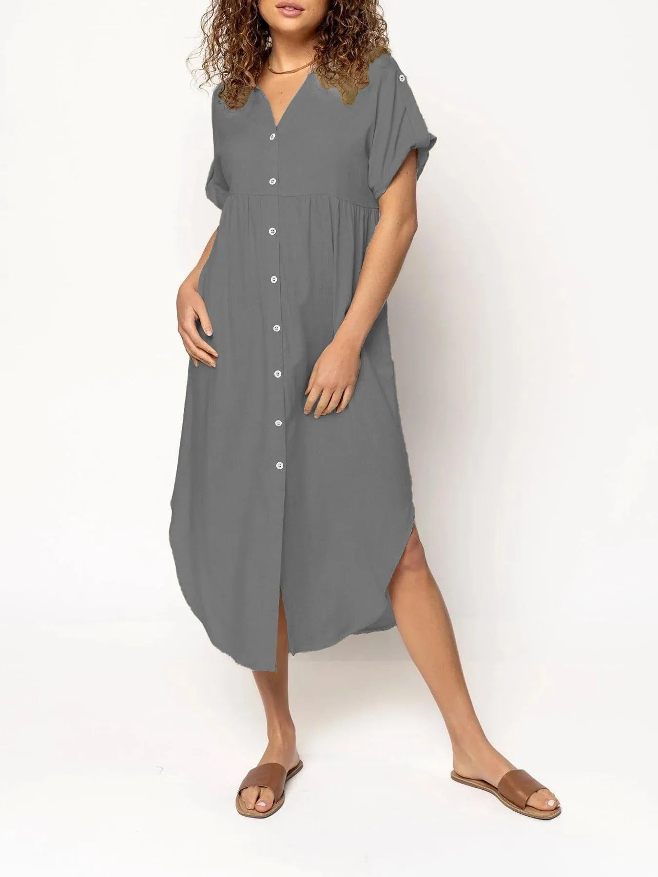 A mid-length casual dress with button detail on the front, shown in a solid colour.