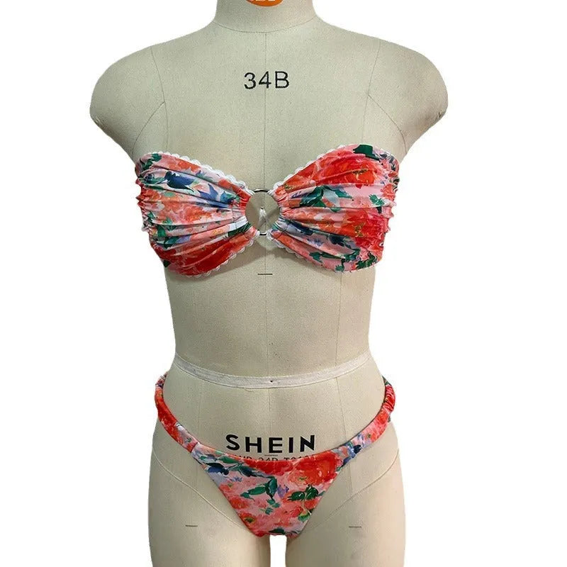 Blue floral print tube top bikini set with lace trim on a mannequin.
