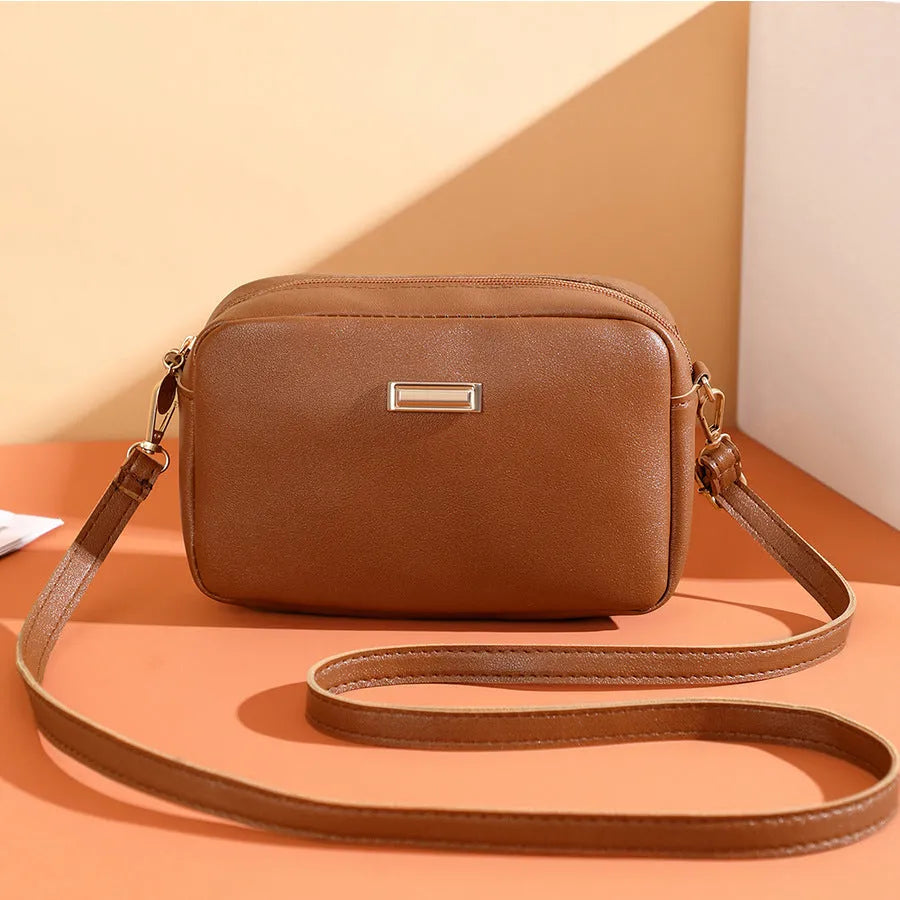 Women's solid colour PU leather shoulder bag with three-dimensional pockets in urban simplicity style